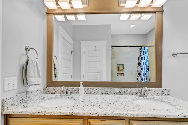 8662 Daintree Ct, Daphne, AL 36526 - bathroom featuring double vanity and a shower with curtain