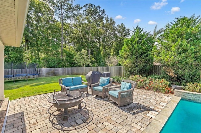 8662 Daintree Ct, Daphne, AL 36526 - fenced backyard with a patio, a trampoline, and outdoor lounge area