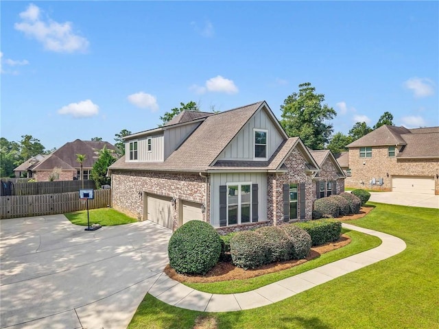 8662 Daintree Ct, Daphne, AL 36526 - craftsman-style home with board and batten siding, an attached garage, driveway, brick siding, and roof with shingles
