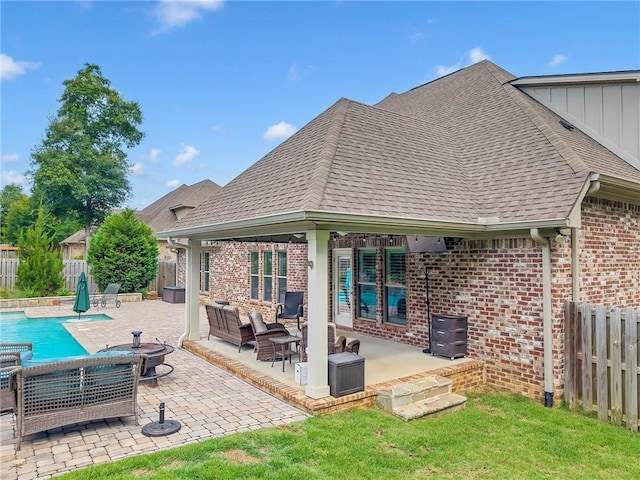 8662 Daintree Ct, Daphne, AL 36526 - back of property featuring brick siding, a fenced backyard, board and batten siding, an outdoor living space, and a gazebo