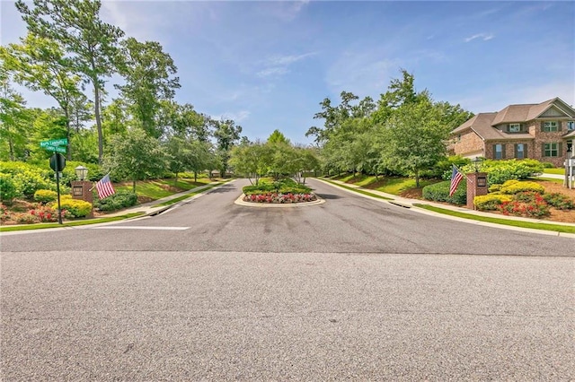 8662 Daintree Ct, Daphne, AL 36526 - view of asphalt street with sidewalks and curbs