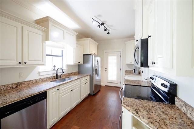kitchen featuring stainless steel appliances, white cabinets, dark wood finished floors, and a sink