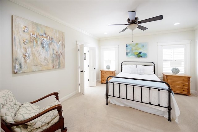bedroom with light colored carpet, recessed lighting, crown molding, a ceiling fan, and baseboards
