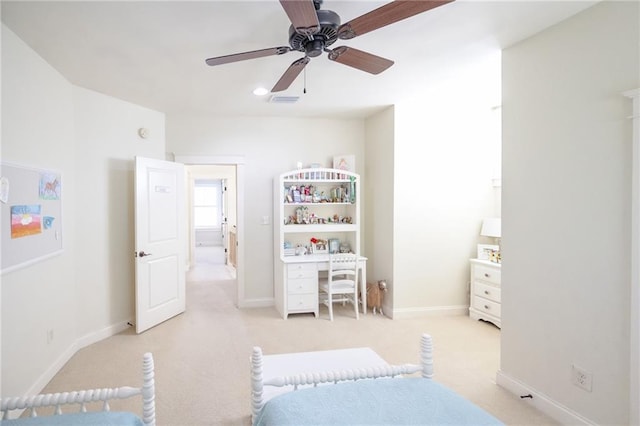 bedroom featuring light carpet, baseboards, visible vents, and ceiling fan
