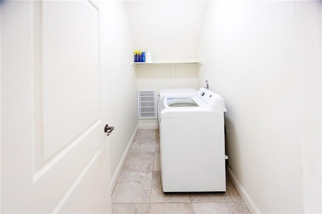 laundry room with baseboards, washer and dryer, visible vents, light tile patterned flooring, and laundry area
