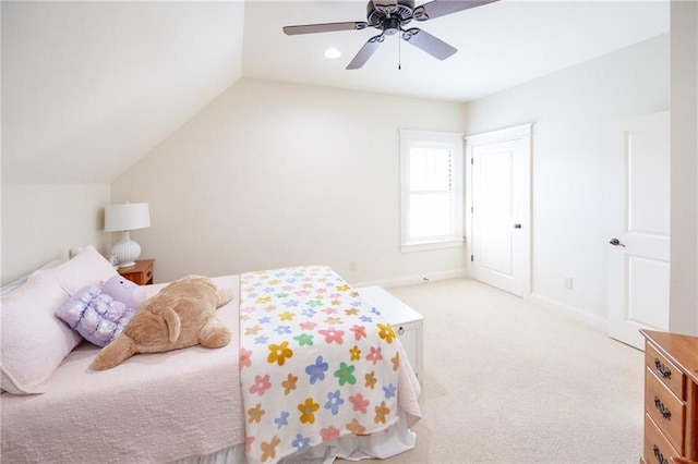 bedroom with light carpet, baseboards, lofted ceiling, and ceiling fan