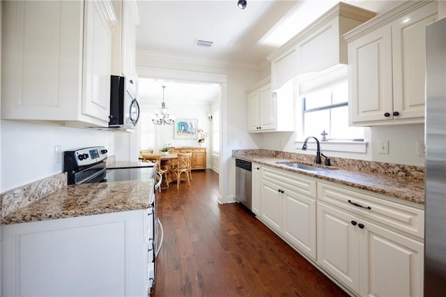 kitchen featuring a sink, white cabinetry, visible vents, and appliances with stainless steel finishes