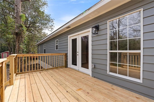 wooden deck featuring french doors