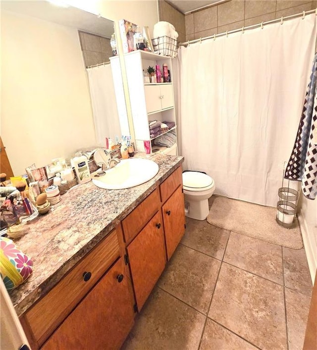 bathroom with toilet and vanity