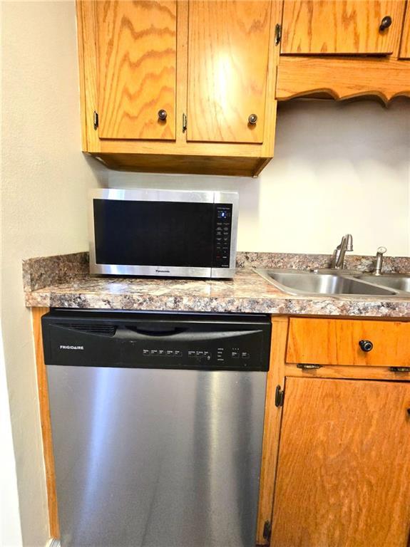 kitchen featuring stainless steel appliances and sink