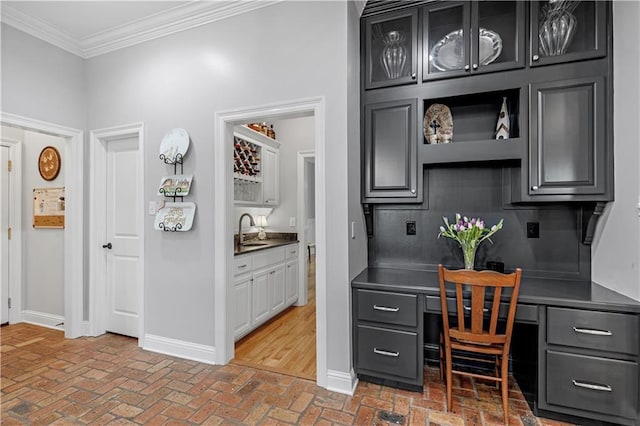 office featuring ornamental molding and indoor wet bar