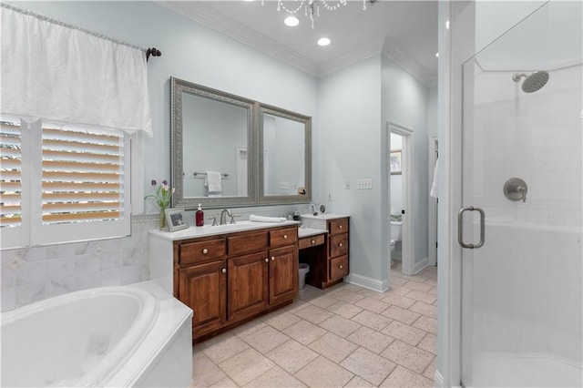 full bathroom featuring independent shower and bath, ornamental molding, vanity, and toilet