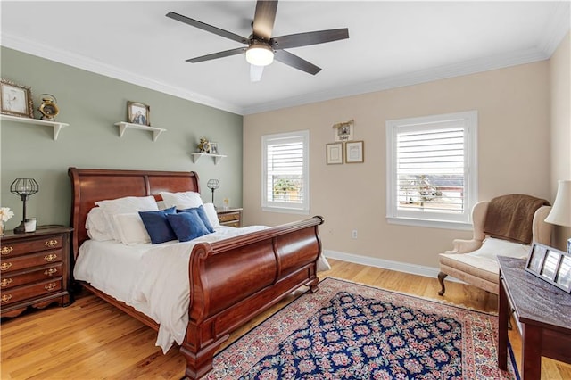 bedroom featuring ornamental molding, ceiling fan, and light hardwood / wood-style flooring