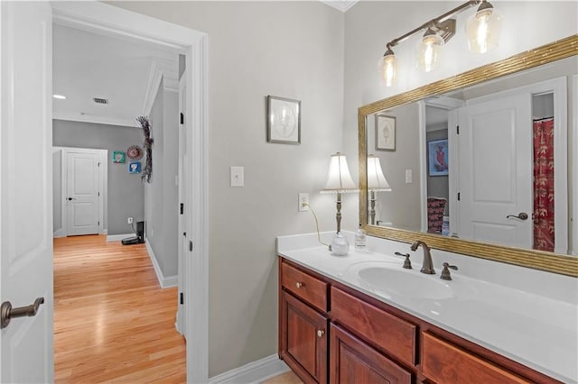 bathroom featuring hardwood / wood-style flooring and vanity