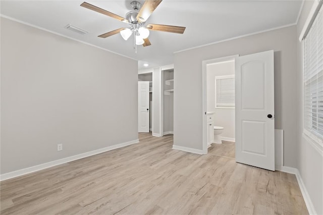 unfurnished bedroom featuring ceiling fan, ornamental molding, connected bathroom, and light hardwood / wood-style flooring