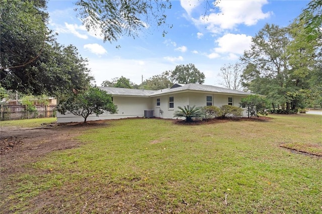 exterior space featuring a yard and central AC unit