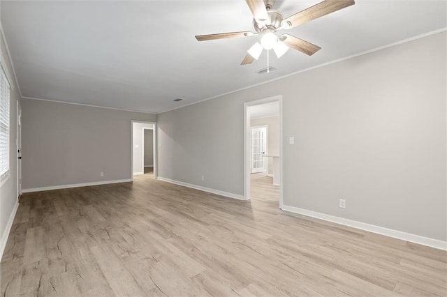 unfurnished room featuring ceiling fan, light hardwood / wood-style flooring, and ornamental molding