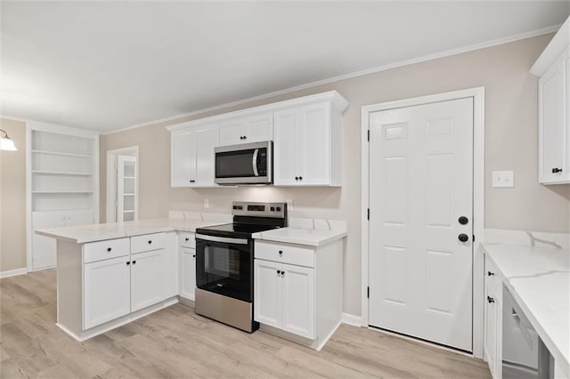 kitchen featuring kitchen peninsula, white cabinetry, and stainless steel appliances