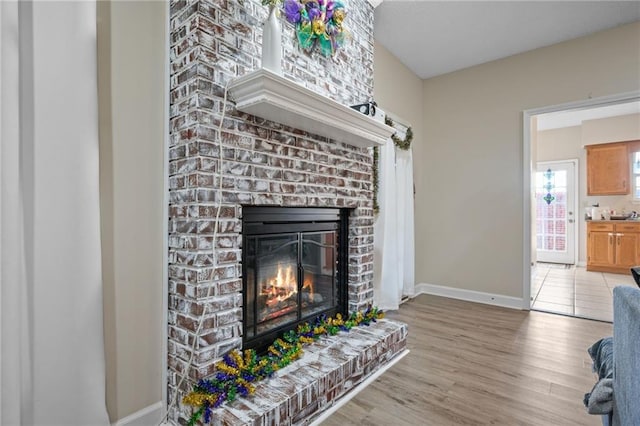 interior space with a fireplace and hardwood / wood-style flooring