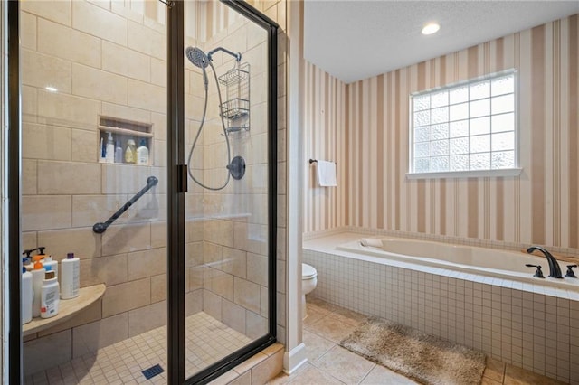 bathroom featuring a textured ceiling, shower with separate bathtub, tile patterned flooring, and toilet