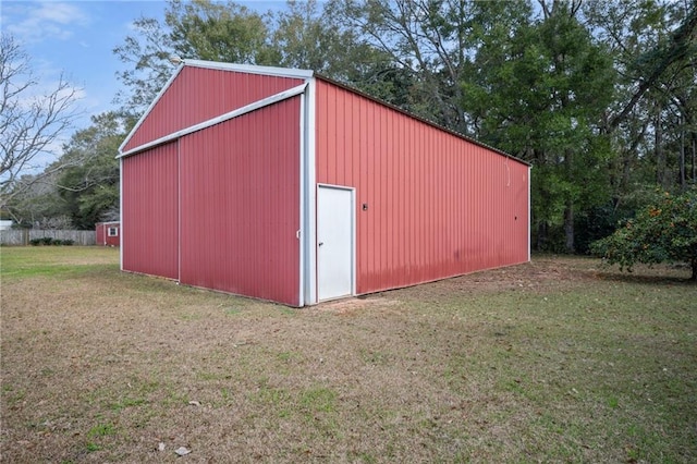 view of outdoor structure featuring a yard