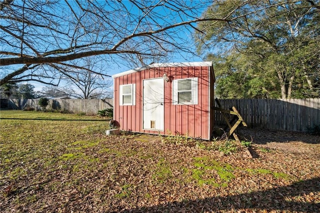 view of outbuilding featuring a yard