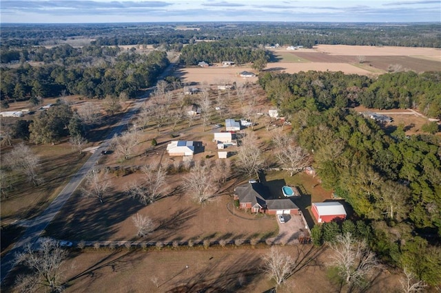 birds eye view of property with a rural view