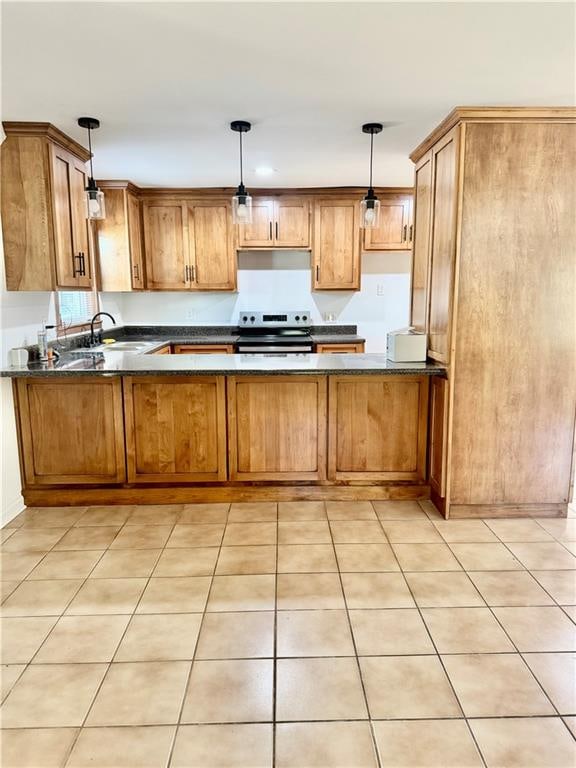 kitchen featuring sink, stainless steel electric range oven, light tile patterned floors, decorative light fixtures, and kitchen peninsula