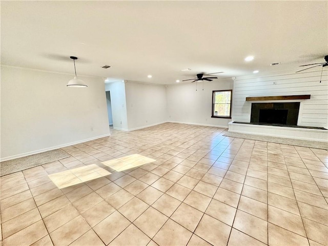 unfurnished living room featuring light tile patterned floors and ceiling fan