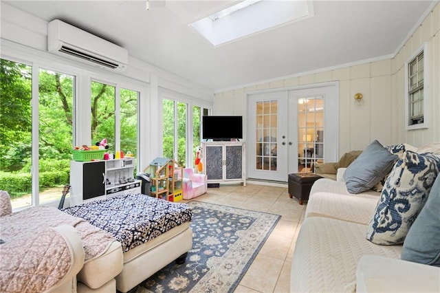 sunroom / solarium with french doors, tile patterned flooring, lofted ceiling with skylight, and a wall mounted AC