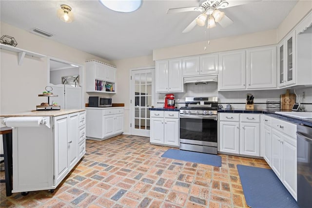 kitchen with ceiling fan, stainless steel appliances, white cabinetry, under cabinet range hood, and glass insert cabinets