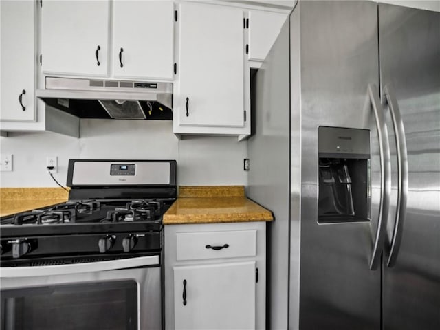 kitchen with appliances with stainless steel finishes and white cabinets