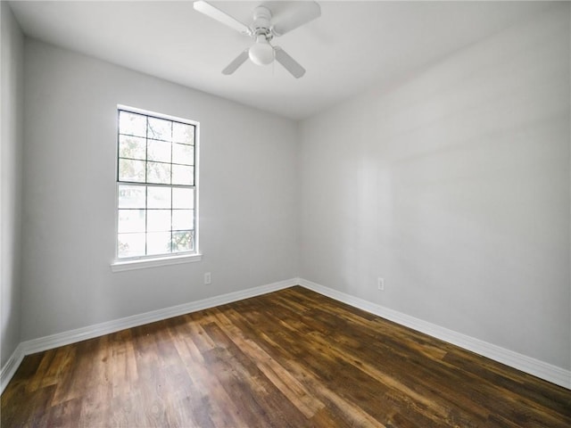 spare room featuring ceiling fan and dark hardwood / wood-style floors