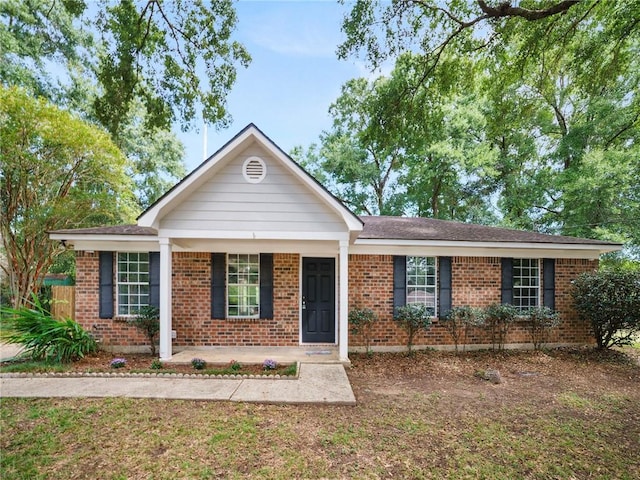 single story home with a porch