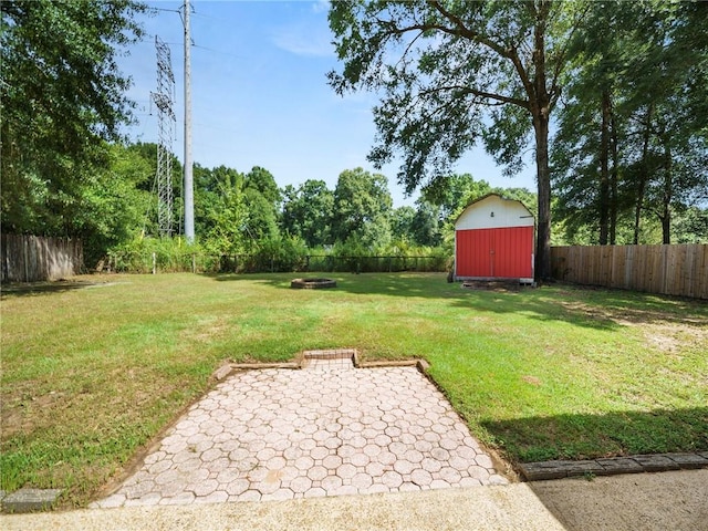 view of yard with a patio area and a storage unit