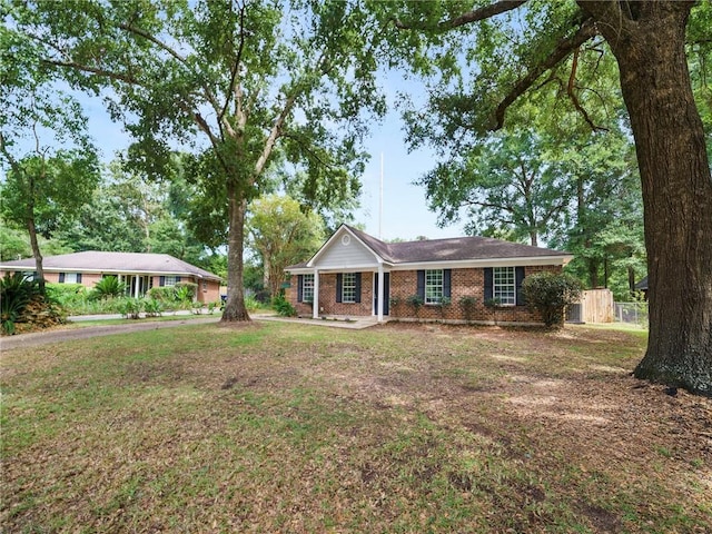 ranch-style house with a front lawn