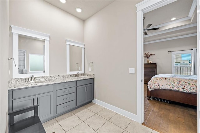 bathroom with ceiling fan, tile patterned floors, and vanity