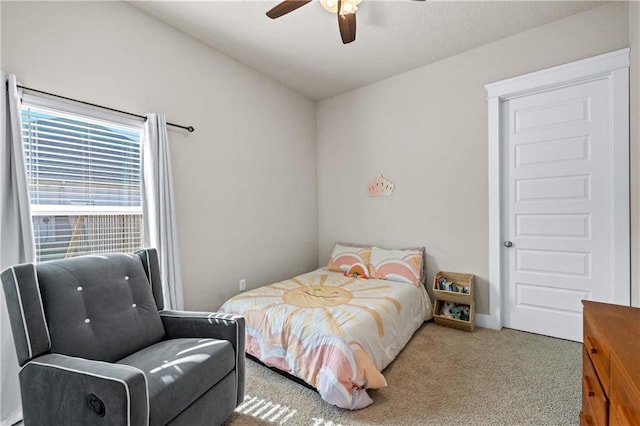 bedroom with ceiling fan and light carpet