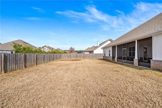 view of yard featuring a sunroom