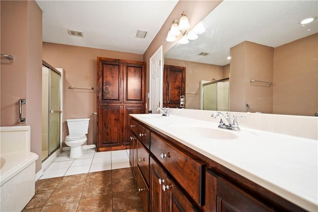 full bathroom featuring toilet, tile patterned floors, vanity, and separate shower and tub