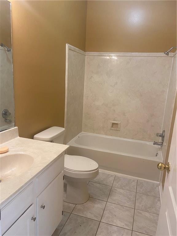 full bathroom with tile patterned flooring, vanity, bathing tub / shower combination, and toilet