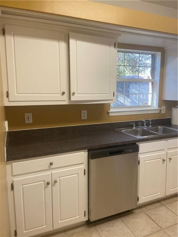 kitchen with sink, white cabinets, dishwasher, and light tile patterned flooring