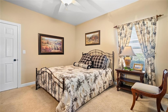 bedroom featuring light carpet and ceiling fan