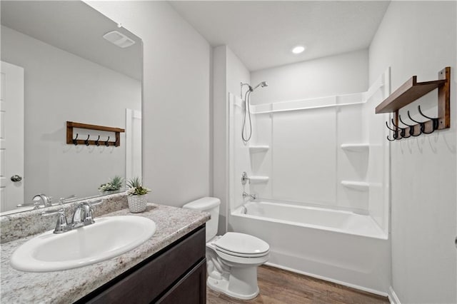 10520 Wales Ln, Spanish Fort, AL 36527 - bathroom featuring wood finished floors, toilet, vanity, and tub / shower combination