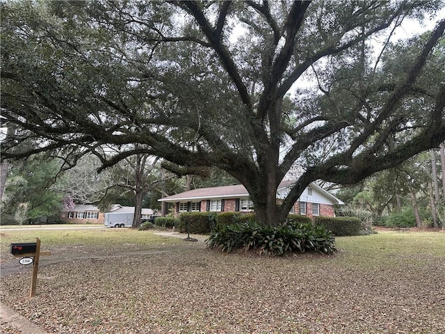 ranch-style house with brick siding