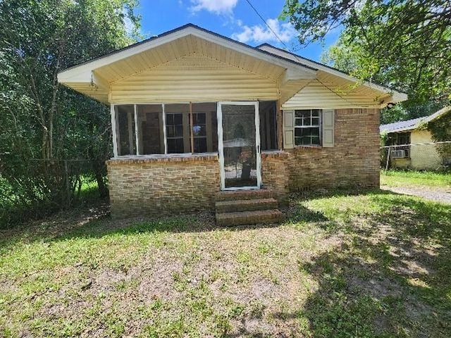 2805 Banks Ave, Mobile, AL 36617 - view of front of property featuring entry steps, brick siding, and a sunroom