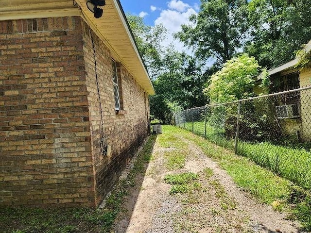 2805 Banks Ave, Mobile, AL 36617 - view of side of home featuring brick siding and a cooling unit