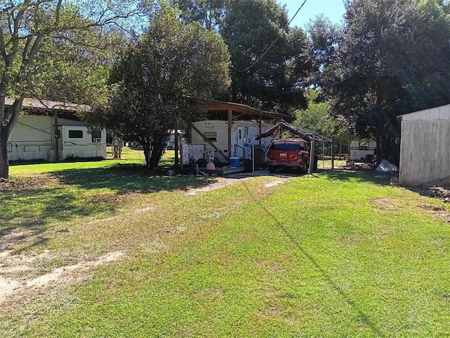 view of yard with a carport