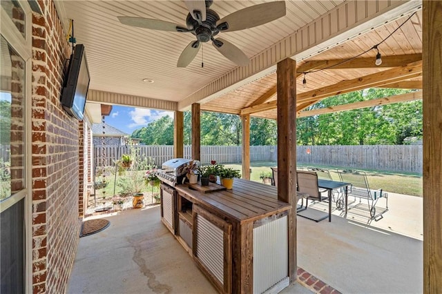 view of patio featuring a fenced backyard, outdoor dining space, ceiling fan, and a grill