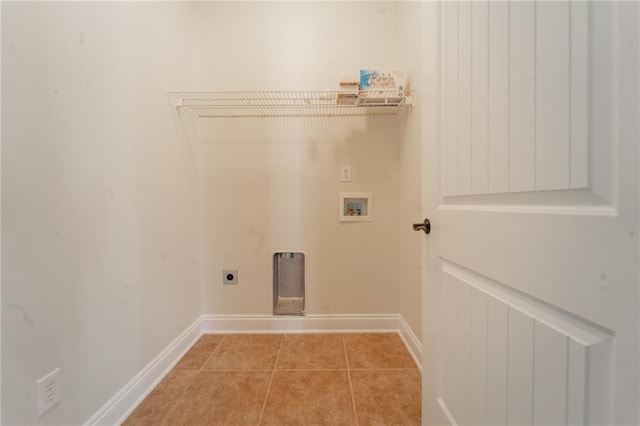 washroom with light tile patterned floors, laundry area, washer hookup, baseboards, and electric dryer hookup